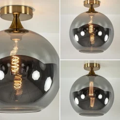Chique plafondlamp goud met smoke/titanium glazen bol></noscript>Straluma Best