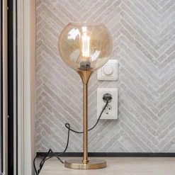 Gouden tafellamp met amber glazen bol 20 cm></noscript>Straluma Hot