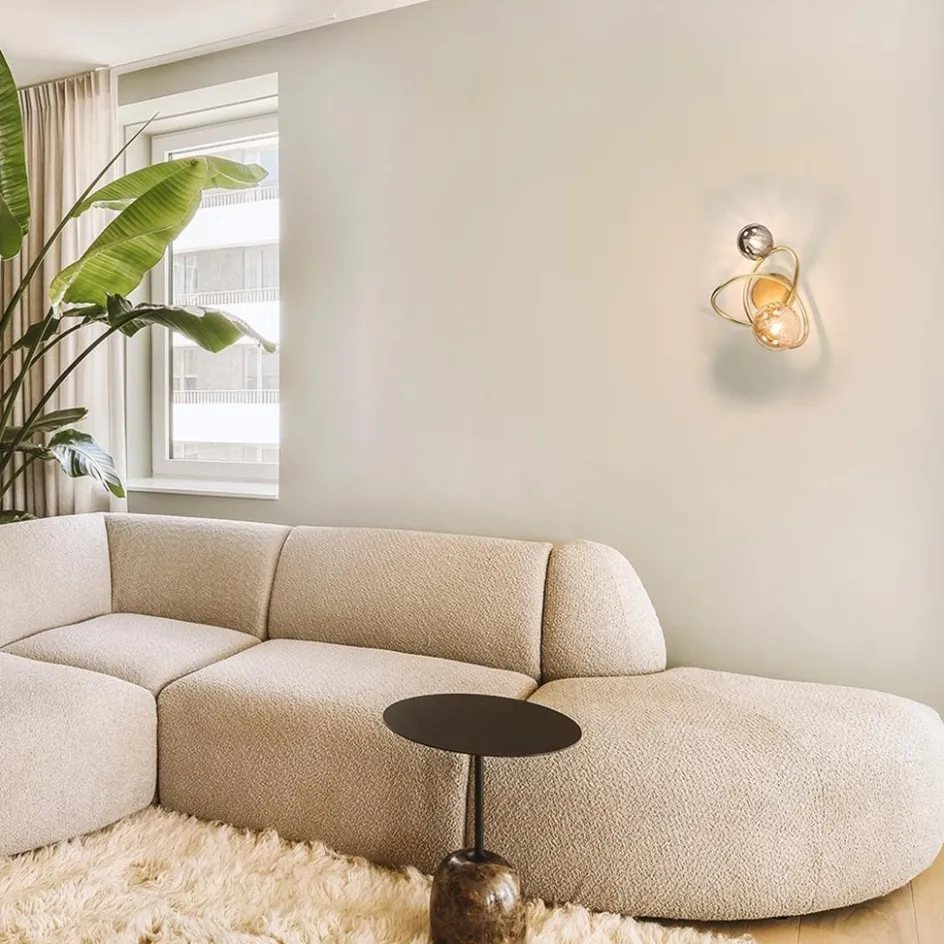 Gouden wandlamp met smoke en amber glas>Straluma Online