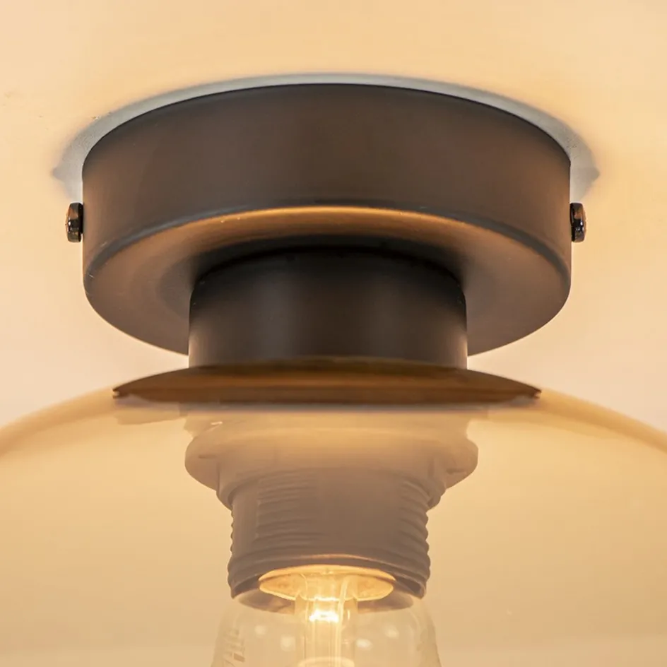 Retro plafondlamp zwart met amber glazen bol>Straluma New
