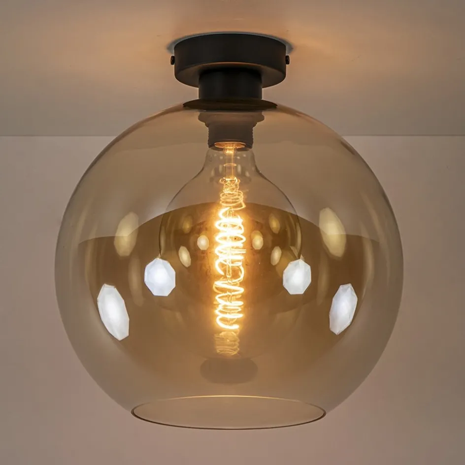 Retro plafondlamp zwart met amber glazen bol>Straluma New